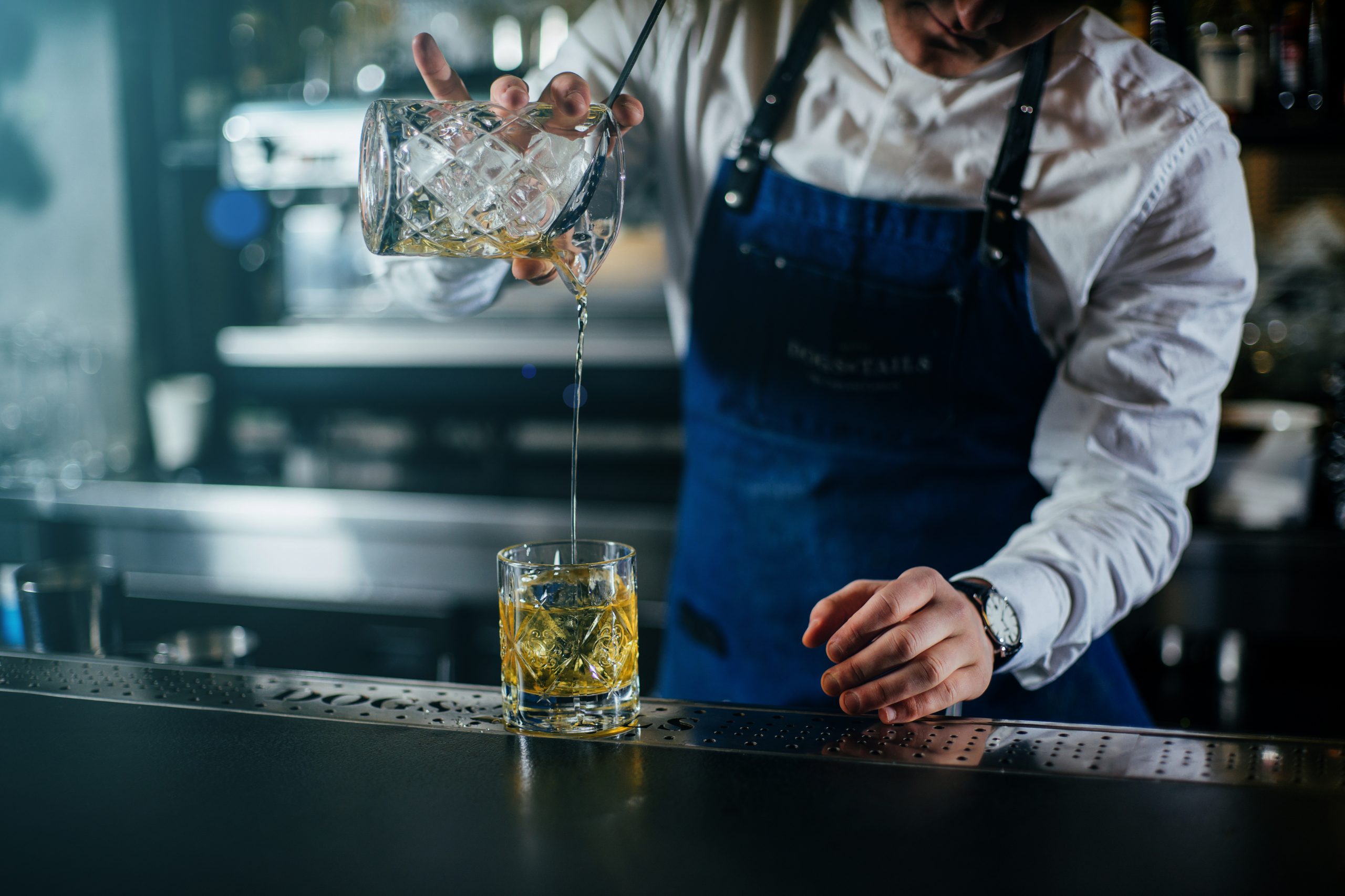 bartender pouring cocktail